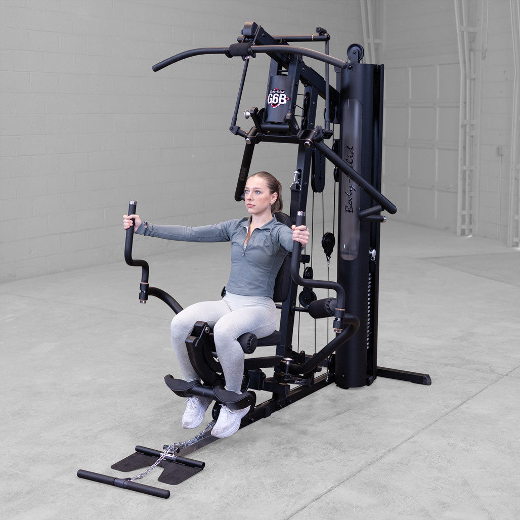 Body-Solid G6B gym in use with chest press