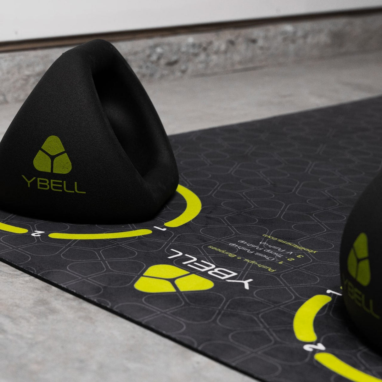 TRX YBell Exercise Mat close-up with YBell logo
