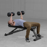 Body-Solid GFID225B bench with user doing chest press