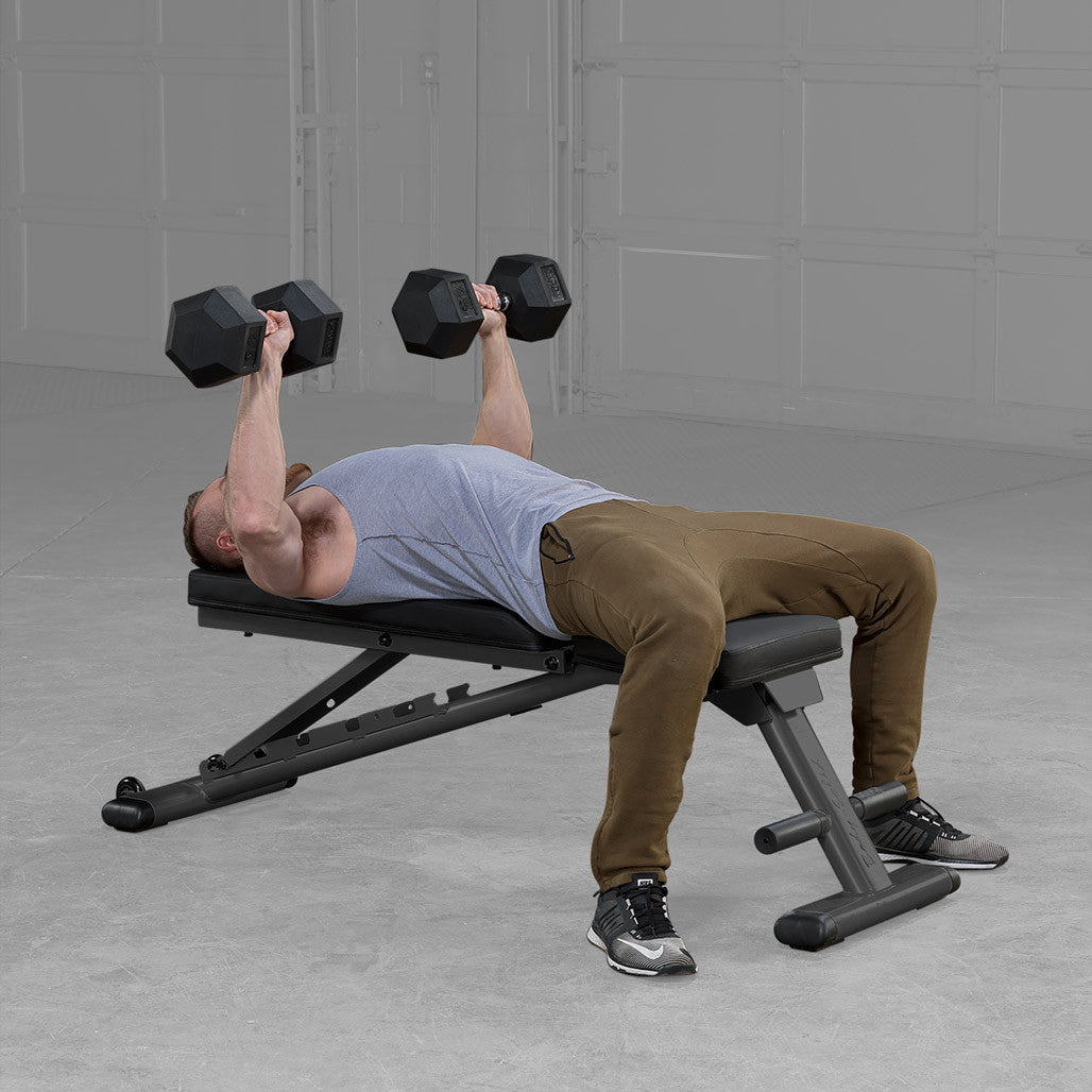 Body-Solid GFID225B bench in use with dumbbells