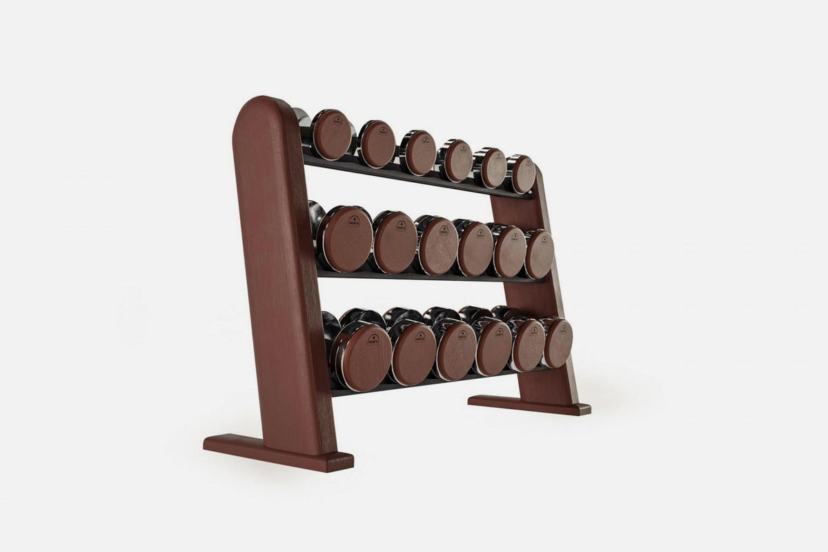 Three-tier club-wood rack holding nine pairs of nickel-plated dumbbells with dark reddish-brown wood end caps