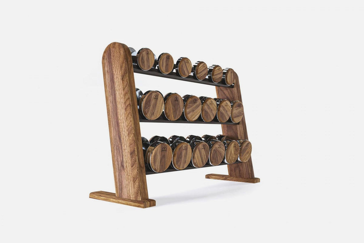 Three-tier walnut rack holding nine pairs of nickel-plated dumbbells with dark wood-grain end caps