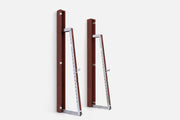 Two wall-mounted squat racks in dark reddish-brown wood, one folded shut and one opened to a silver ladder