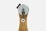 Close-up of the NOHRD WaterGrinder crank arm with handle positions on an oak wood frame