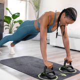 TRX YBell Exercise Mat in use with push-up bars
