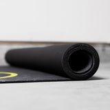 TRX YBell Exercise Mat rolled side view on floor
