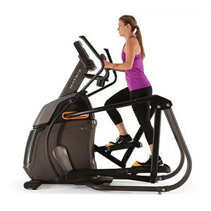Woman Running on Matrix A30 Ascent Trainer Elliptical side view